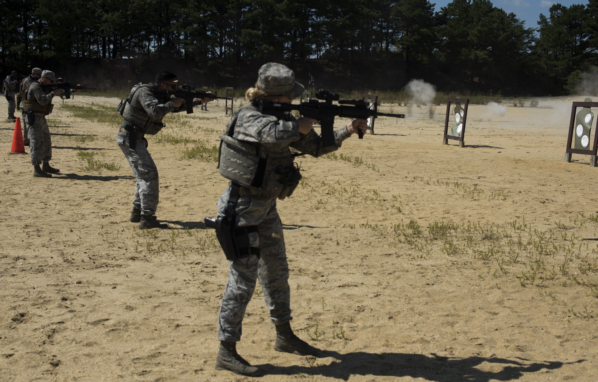 U.S. Air Force Staff Sgt. Kayla Favor, MacDill Air Force Base, Fla., 6th Security Forces Squadron training instructor, shoots an M4 carbine assault rifle during weapons training during preparation for representing Air Mobility Command in the 2018 Defender Challenge on Joint Base McGuire-Dix-Lakehurst, New Jersey, Sept. 4, 2018. Favor took part in the weapons training as one of the skills practiced for the challenge. The competition has been inactive for 14 years due to mission requirements in the wake of 9/11. (U.S. Air Force photo by Airman Ariel Owings)