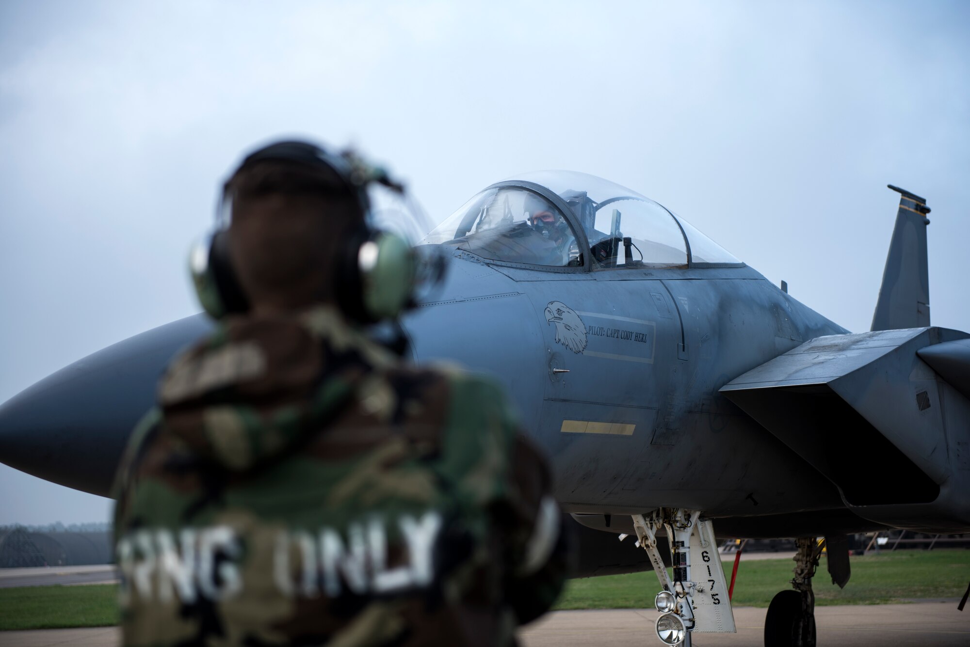 An Airman assigned to the 48th Maintenance Group prepares an F-15C Eagle for a sortie while in Mission Oriented Protective Posture gear during Combat Thursday at Royal Air Force Lakenheath, England, Sept. 6, 2018. Combat Thursday is a newly instituted program developed to familiarize military members with MOPP equipment and procedures, to perform daily operations in any environment. (U.S. Air Force photo/Senior Airman Malcolm Mayfield)