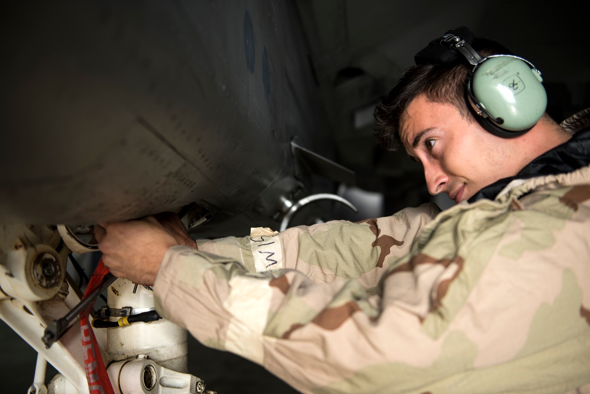 An Airman assigned to the 48th Maintenance Group performs preflight checks on an F-15C Eagle while in Mission Oriented Protective Posture gear during Combat Thursday at Royal Air Force Lakenheath, England, Sept. 6, 2018. The Liberty Wing continues to develop training programs like Combat Thursday to ensure its Airmen can generate combat airpower in a wide range of environments and scenarios at any time in support of U.S. allies and partners around the globe. (U.S. Air Force photo/Senior Airman Malcolm Mayfield)