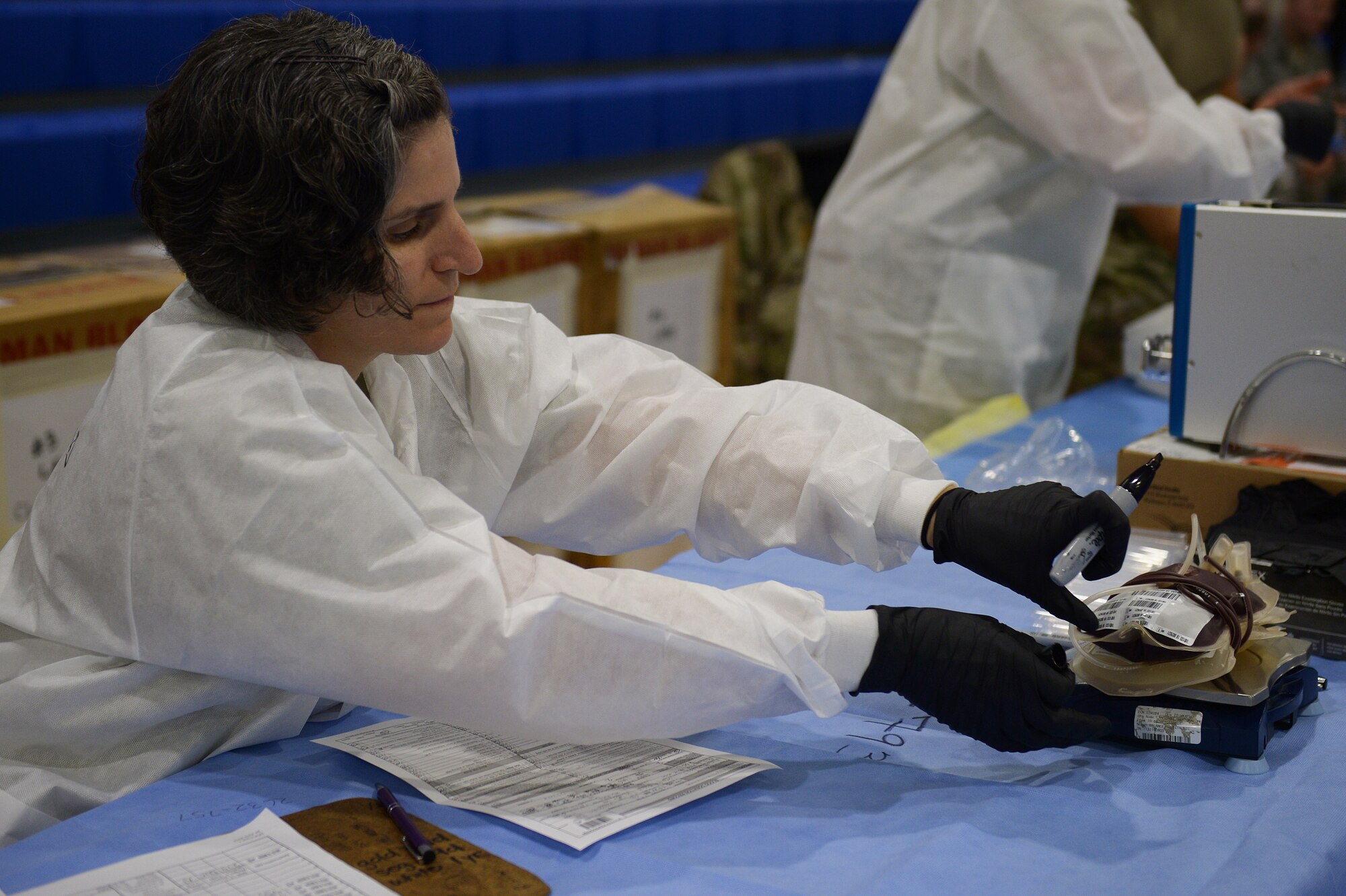 1st Lt. Nyree Watts, Chief of the Armed Services Blood Bank Center-Europe, prepares a bag of blood to be processed at a blood drive hosted by the ASBP at Royal Air Force Lakenheath, England, Sept. 18. 2018. The ASBP collects, process and distribute blood and blood products to U.S. service members in need worldwide.  (U.S. Air Force photo/Airman 1st Class Shanice Williams-Jones)