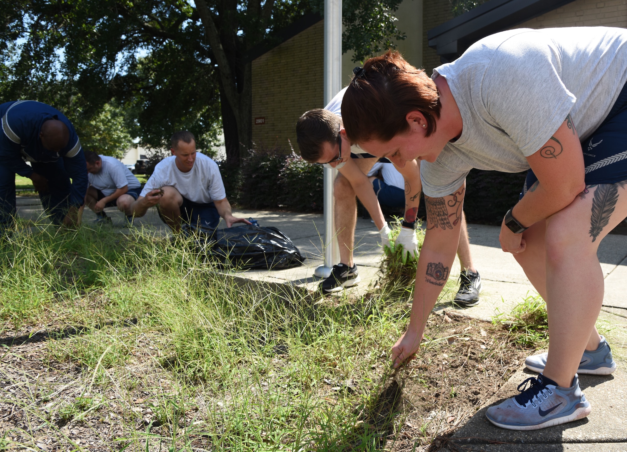 Mathies NCO Academy Airmen provide grounds maintenance around the academy at Keesler Air Force Base, Mississippi, Sept. 18, 2018. In order to assist base operations support, Keesler Airmen will provide grounds maintenance around their work area. (U.S. Air Force photo by Kemberly Groue)