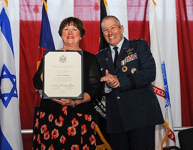 ​The 42nd Adjutant General of Colorado U.S. Air Force Maj. Gen. H. Michael Edwards retires April 2, 2017, after 43 years of military service including 36 years in the Colorado Air National Guard. Mrs. Laury Edwards accepts a Certificate of Appreciation from the U.S. Air Force.