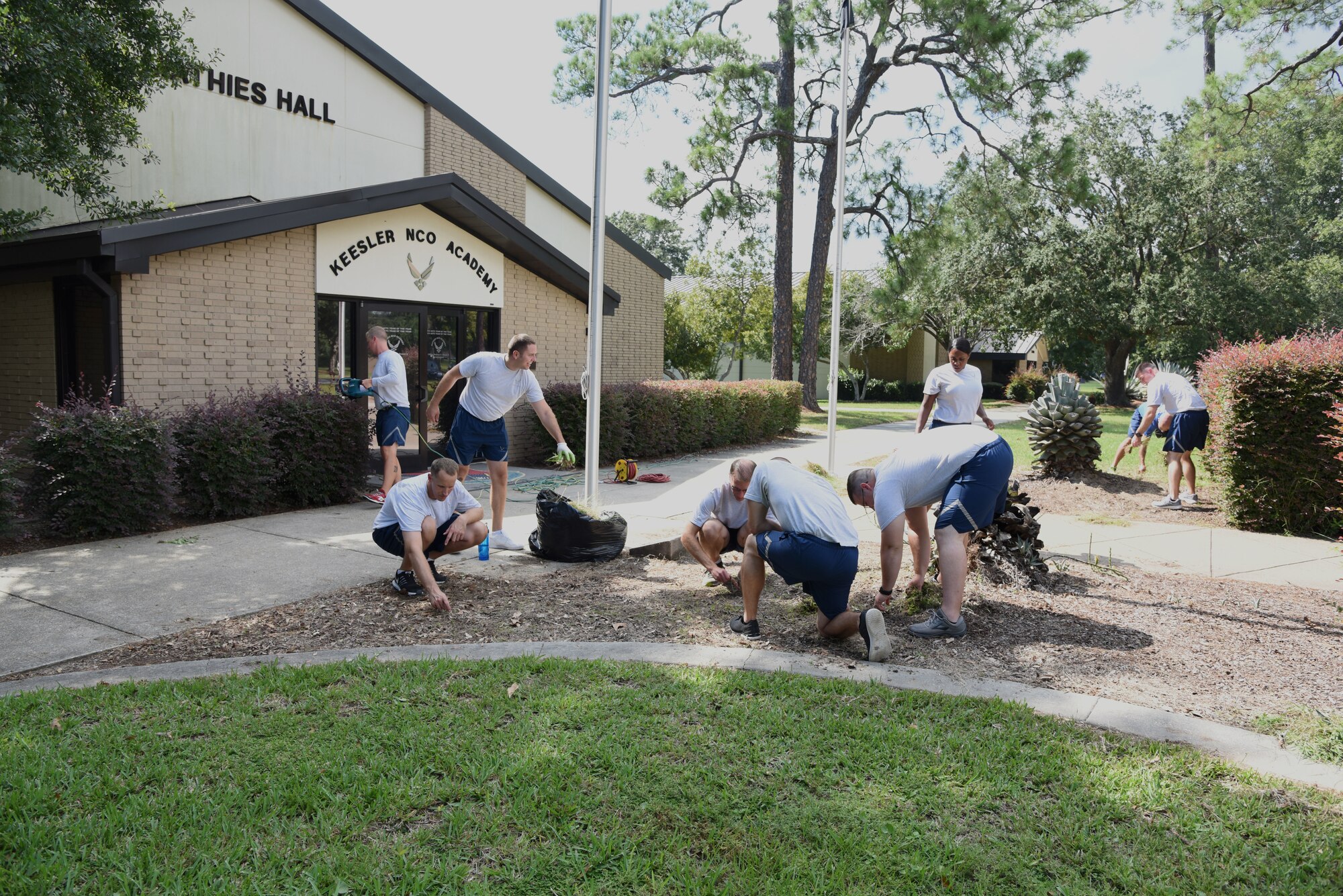 Mathies NCO Academy Airmen provide grounds maintenance around the academy at Keesler Air Force Base, Mississippi, Sept. 18, 2018. In order to assist base operations support, Keesler Airmen will provide grounds maintenance around their work area. (U.S. Air Force photo by Kemberly Groue)