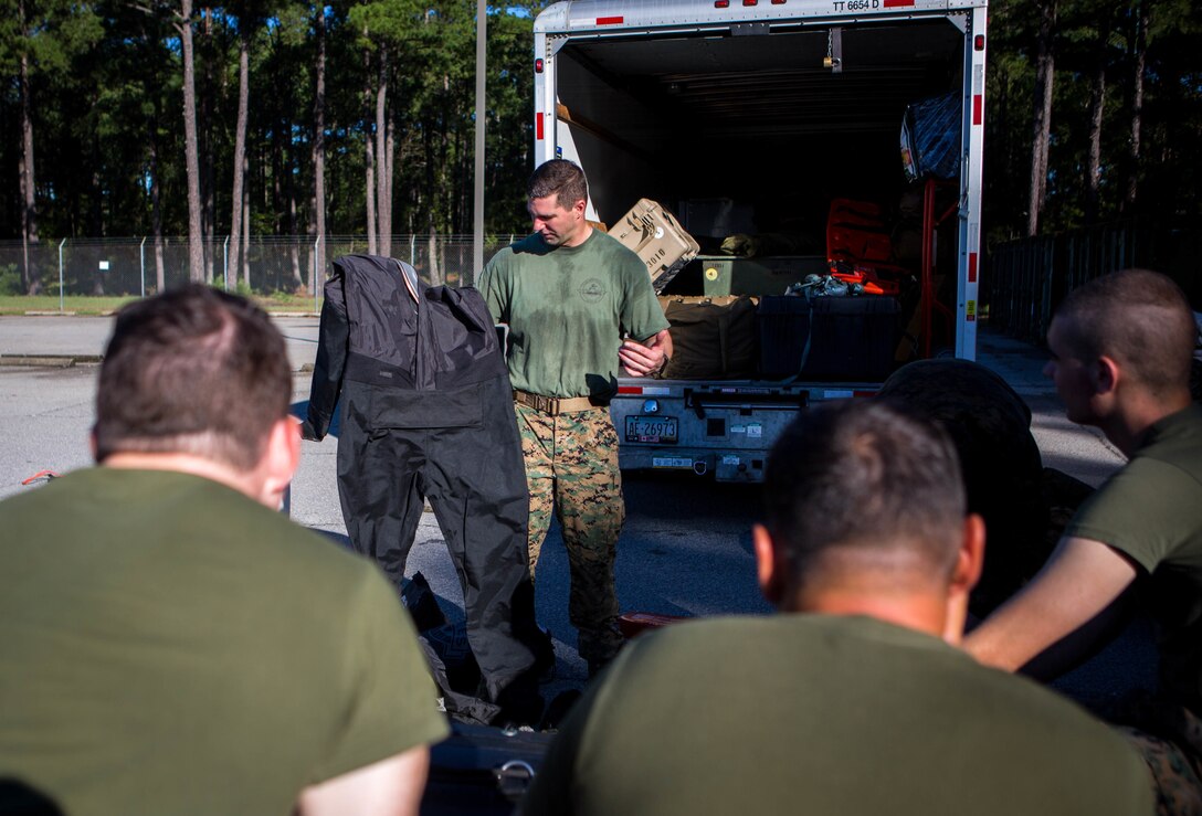 A Marine with 3rd Force Reconnaissance Company, 4th Marine Division, shows a wet suit at the McCrady Training Center, South Carolina, Sept. 18, 2018, in preparation to respond to Hurricane Florence.