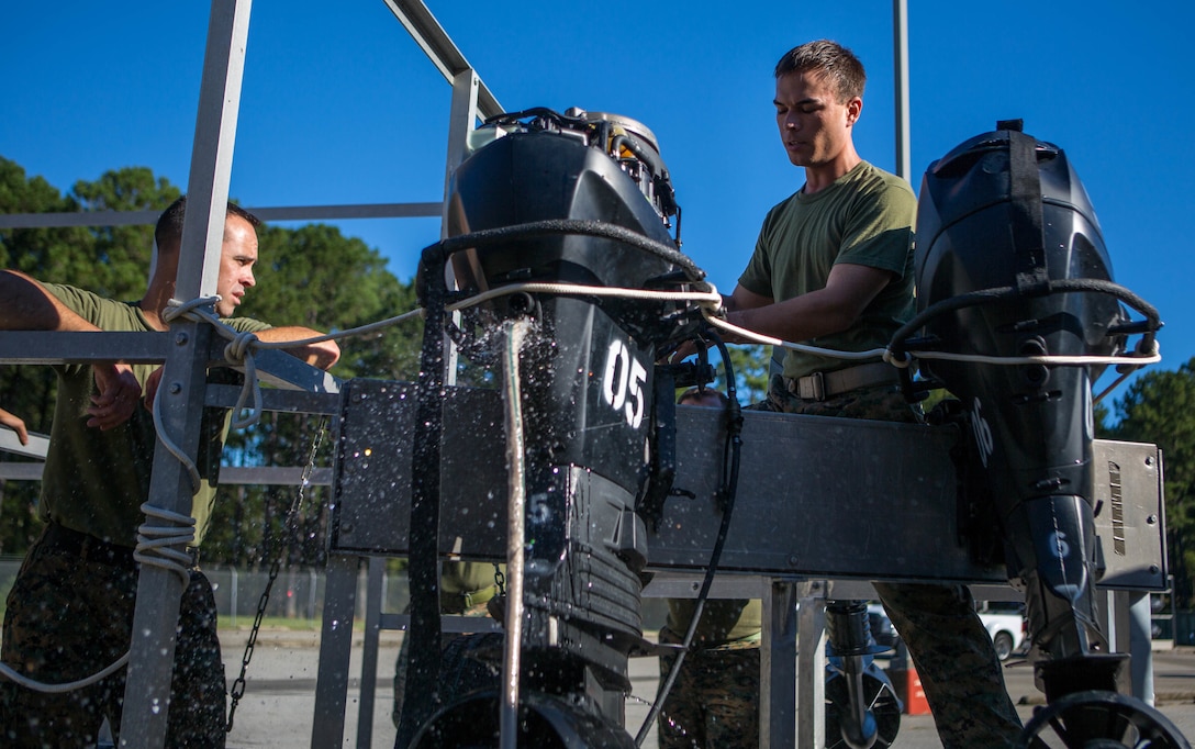 Sgt. Steven M. Holmes, a Small Craft Mechanic with 3rd Force Reconnaissance Company, 4th Marine Division, demonstrates the capabilities of a F470 Combat Rubber Raiding Craft engine at McCrady Training Center, South Carolina, Sept. 18, 2018.