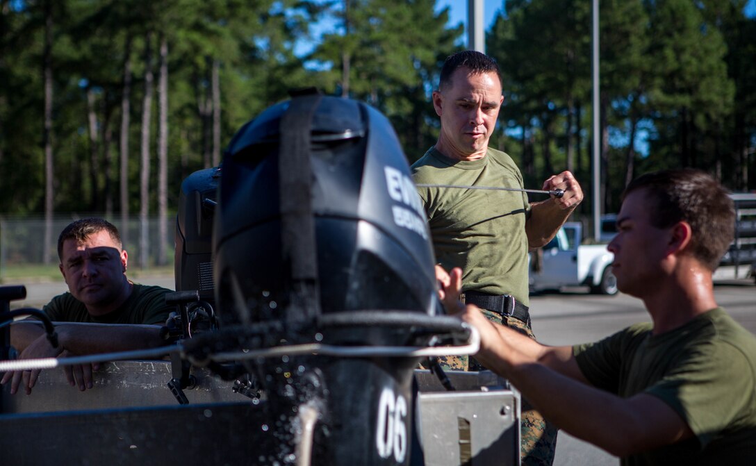 A Marine with 3rd Force Reconnaissance Company, 4th Marine Division, turns on a F470 Combat Rubber Raiding Craft engine at the McCrady Training Center, South Carolina, Sept. 18, 2018, in preparation to respond to Hurricane Florence.