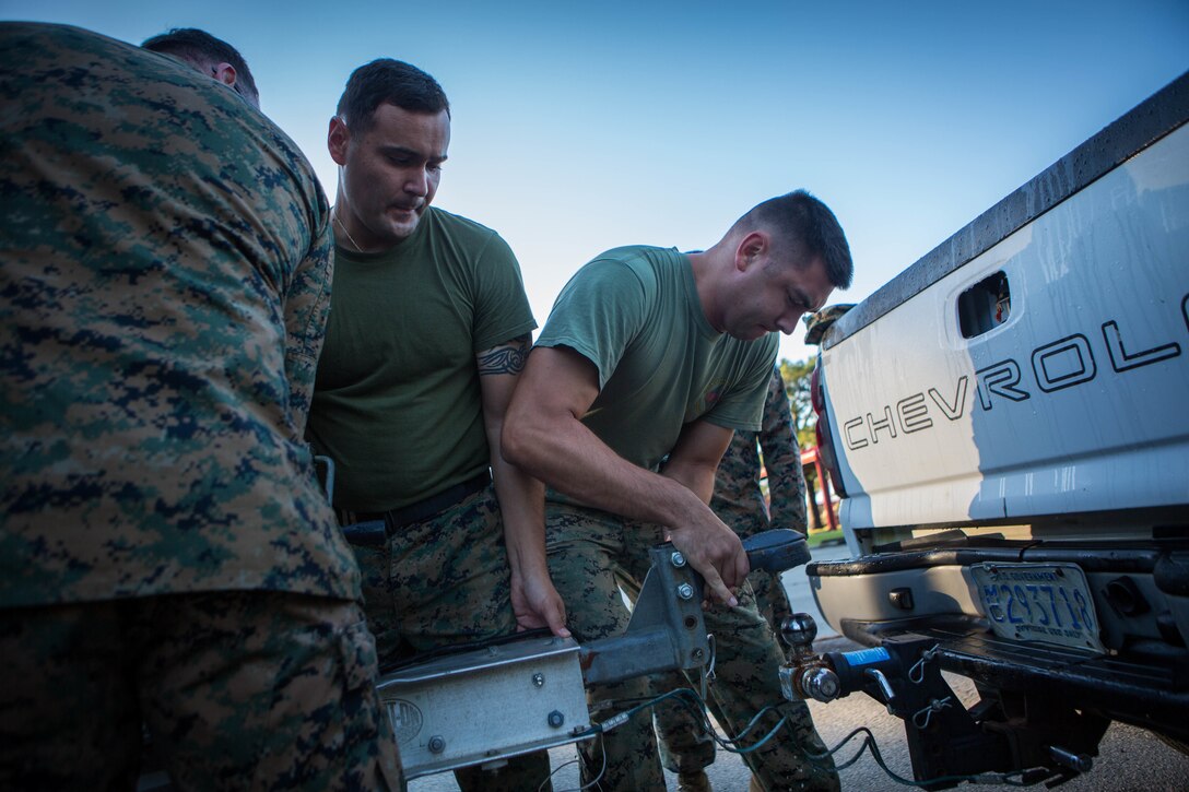 Marines with 3rd Force Reconnaissance Company, 4th Marine Division, unhook a trailer full of Combat Rubber Raiding Crafts at the McCrady Training Center, South Carolina, Sept. 18, 2018, in preparation to respond to Hurricane Florence.
