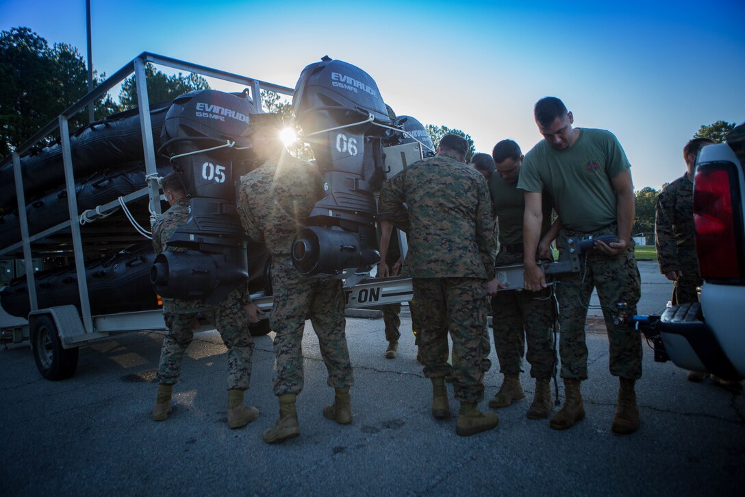 Marines with 3rd Force Reconnaissance Company, 4th Marine Division, unhook a trailer full of Combat Rubber Raiding Crafts at the McCrady Training Center, South Carolina, Sept. 18, 2018, in preparation to respond to Hurricane Florence.