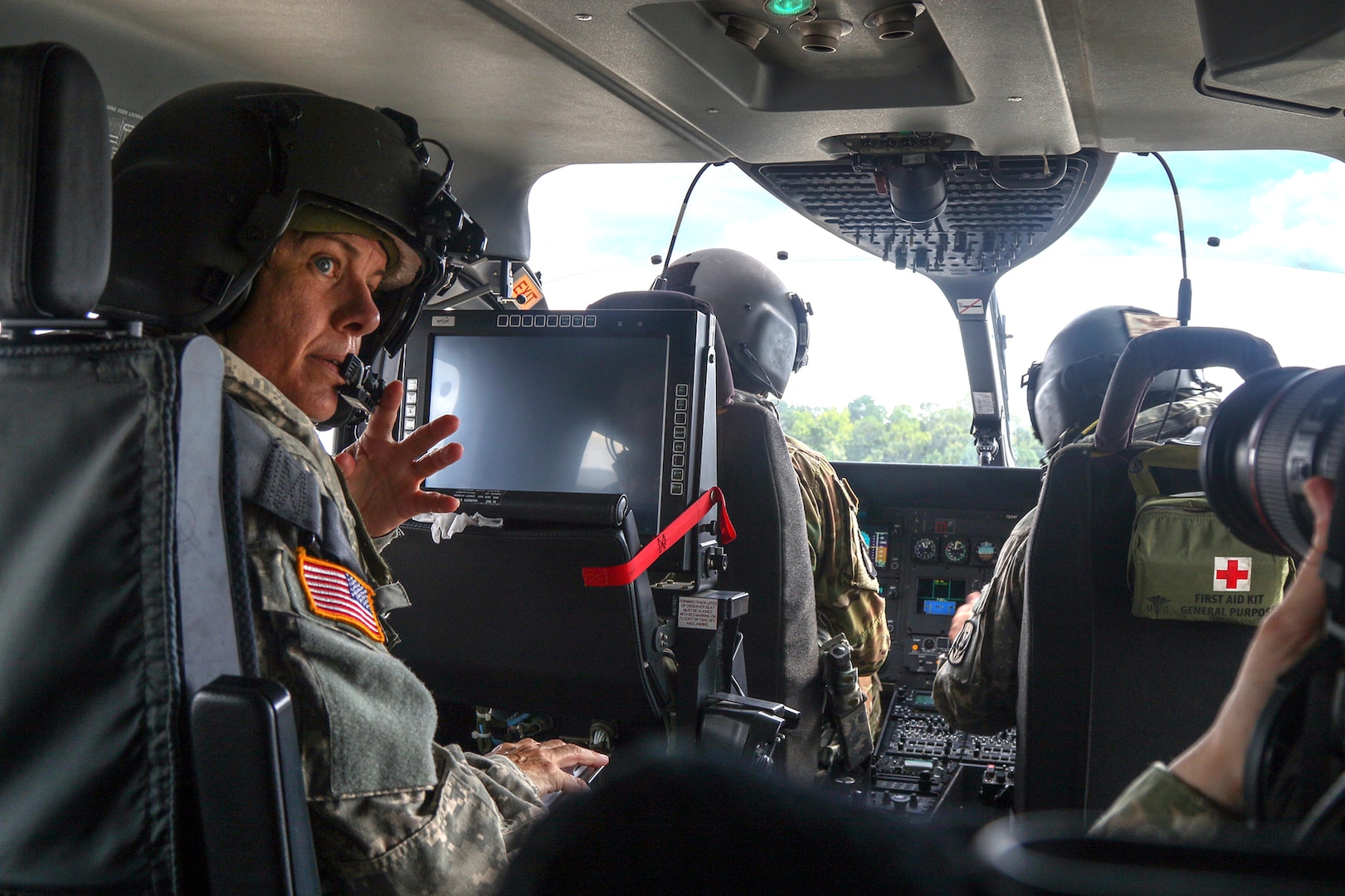 U.S. Army National Guard Capt. Christopher Arndt and Chief Warrant Officer 4 George Millsaps, pilots with the North Carolina Detachment 1 Bravo Company, 2nd 151st Aviation Regiment, along with crew chief Staff Sgt. Kathy Mcquay, conduct aerial search missions from a UH-72A Lakota light utility helicopter, Sept. 17.