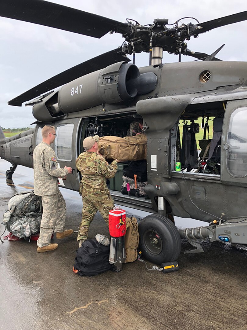 Indiana National Guard soldiers with the 2-238th General Support Aviation Battalion prepare a UH-60 for takeoff at the Gary Aviation Facility and prep the aircraft for hurricane relief efforts on September 16, 2018.