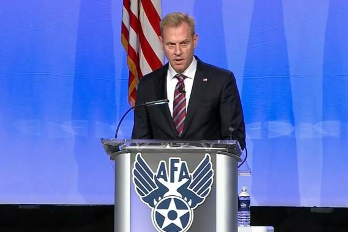 Deputy Defense Secretary Patrick Shanahan speaks from behind a podium.