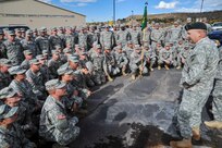 Members of the 193rd Military Police Battalion receive a farewell from their family and firends at the Douglas County Events Center Oct. 21, 2014, as they depart for their year-long detainee operations mission in Guantanamo Bay, Cuba. The members will spend a year away from their families and civilian employers. Many of the unit members work as civilian law enforcement officers and corrections officers in their fulltime jobs, which contributes to their readiness and experience.

(U.S. Army National Guard Photo by Sgt. Joseph VonNida /RELEASED)