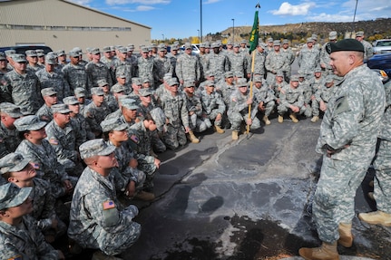 Members of the 193rd Military Police Battalion receive a farewell from their family and firends at the Douglas County Events Center Oct. 21, 2014, as they depart for their year-long detainee operations mission in Guantanamo Bay, Cuba. The members will spend a year away from their families and civilian employers. Many of the unit members work as civilian law enforcement officers and corrections officers in their fulltime jobs, which contributes to their readiness and experience.

(U.S. Army National Guard Photo by Sgt. Joseph VonNida /RELEASED)