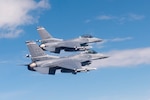 Two U.S. Air Force F-16 Fighting Falcons from the 120th Fighter Squadron, Colorado Air National Guard, fly together during a photo chase mission around Denver Colo. May 29, 2015. (U.S. Air National Guard photo by, Tech. Sgt. Wolfram M. Stumpf)(RELEASED)