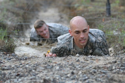 ​U.S. Soldiers Capt. Robert Killian, Colorado Army National Guard, and 1st Lt. Niclolas Plocar, Wisconsin Army National Guard, negotiate the Malvesti Field Obstacle Course during the 2014 Best Ranger competition at Fort Benning, Ga., April 11, 2014. (U.S. Army photo)