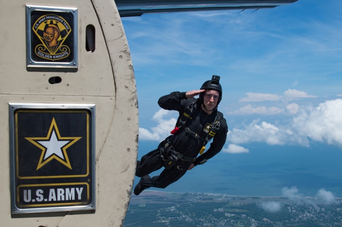 A man jumps out of an airplane.