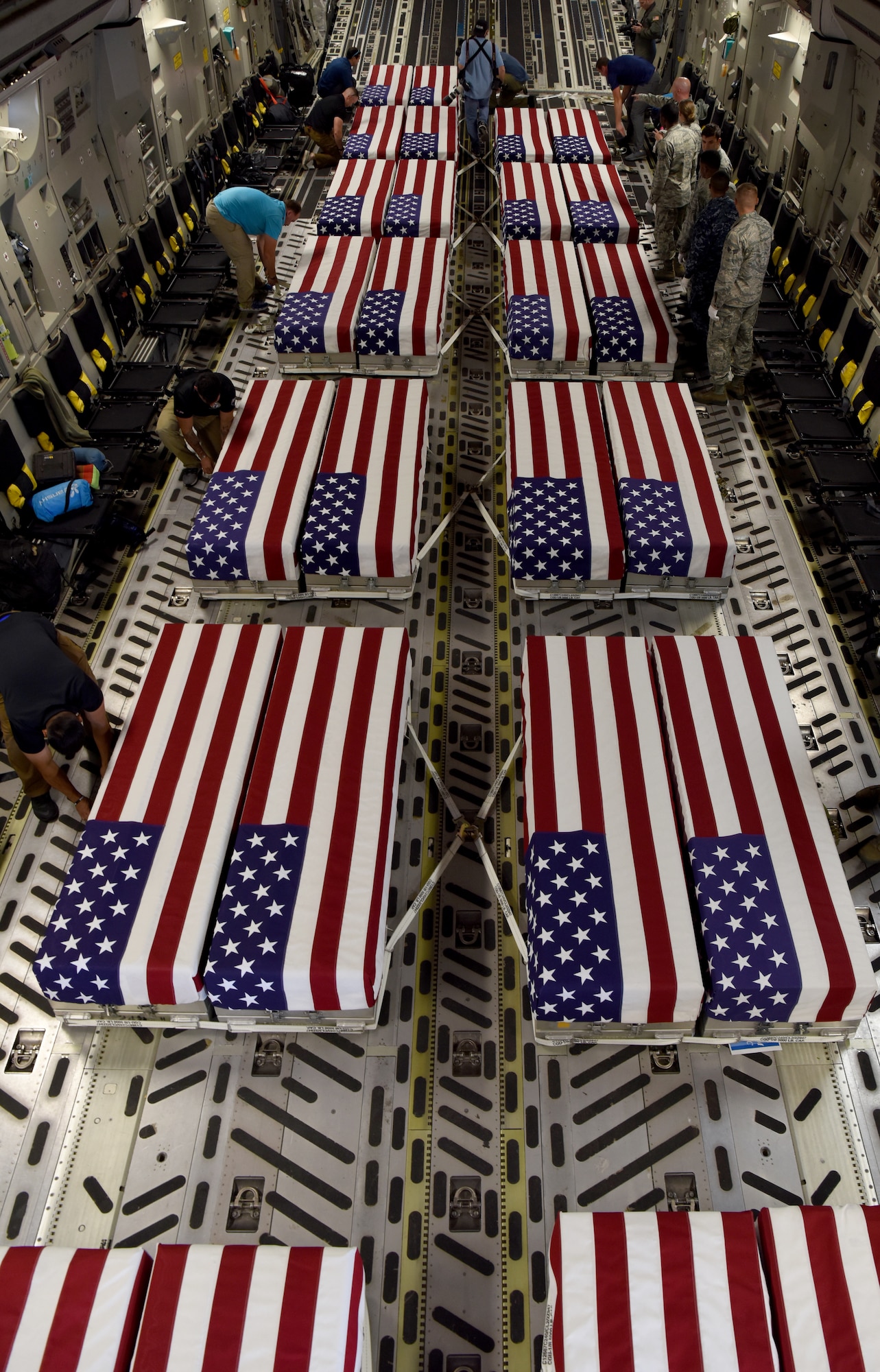 Transfer cases of 26 WWII human remains sit in a C-17 Globemaster III Sept. 14, 2018, at Offutt Air Force Base, Nebraska. Aircrew from Joint Base Charleston, S.C. was tasked to deliver the remains due to its rapid mobility capabilities.