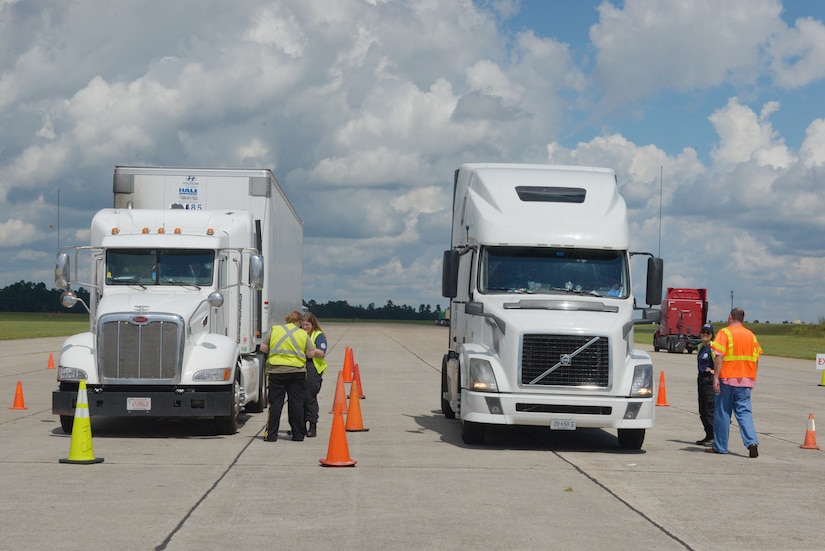 Members of the U.S. Department of Homeland Security Federal Emergency Management Agency receive trucks filled with goods and commodities in support of Hurricane Florence relief efforts Sept. 17, 2018, at Joint Base Charleston’s North Auxiliary Airfield located in the town of North, S.C. The NAAF serves as a staging area where humanitarian assets are gathered and sent out to areas affected by Hurricane Florence.