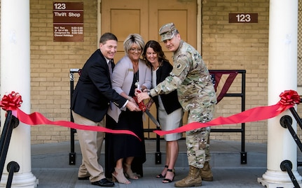 (From left) Robert Naething, deputy to the commanding general, U.S. Army North (Fifth Army); Angie Ryder, Fort Sam Houston Thrift Shop manager; Stacy Vick, Fort Sam Houston Thrift Shop bookkeeper; and Maj. Gen. Mark R. Stammer, commanding general, U.S. Army South, cut the ribbon to open the relocated Fort Sam Houston Thrift Shop at its new location of 1210 Stanley Road, building 123. The site was the location for the former Fort Sam Houston Museum.