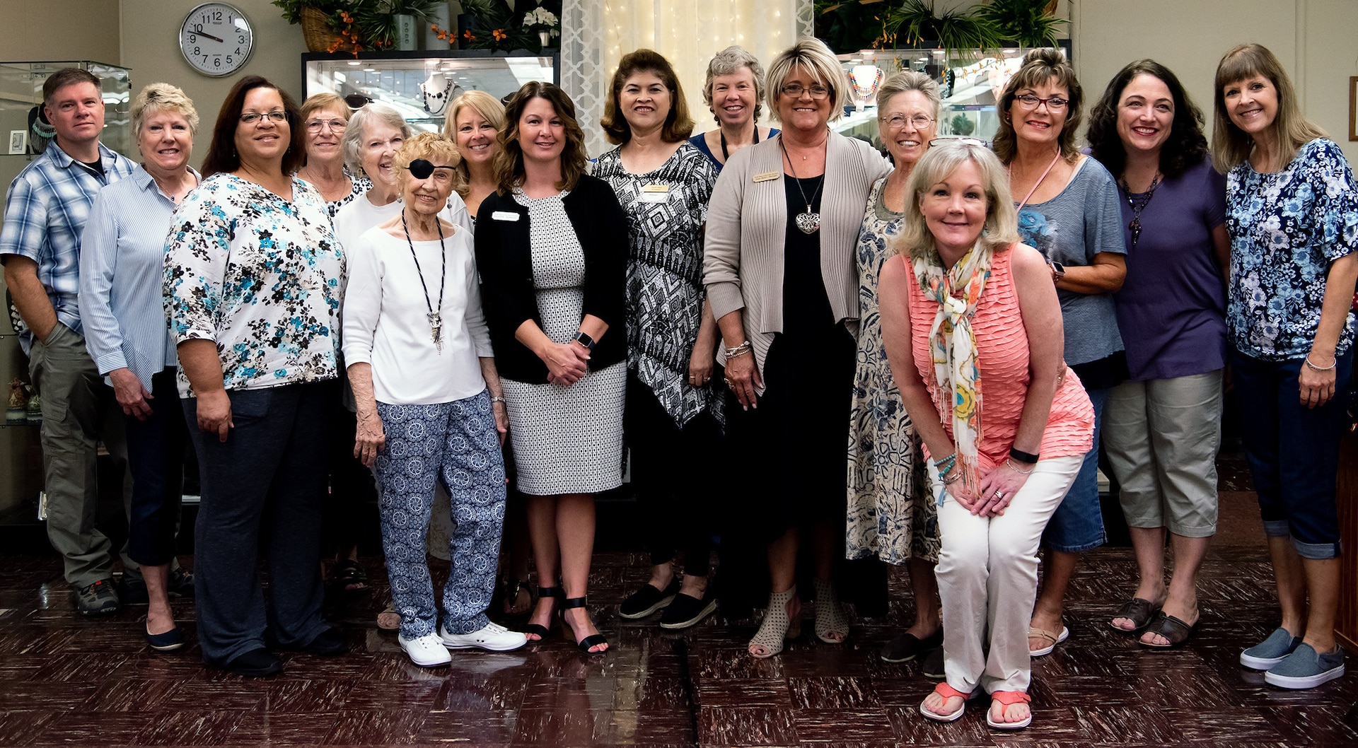 The volunteer staff of the Fort Sam Houston Thrift Shop gather for a photo after the grand re-opening ceremony Sept. 19. The new location, which used to be the site of the Fort Sam Houston Museum is 1210 Stanley Road, building 123.