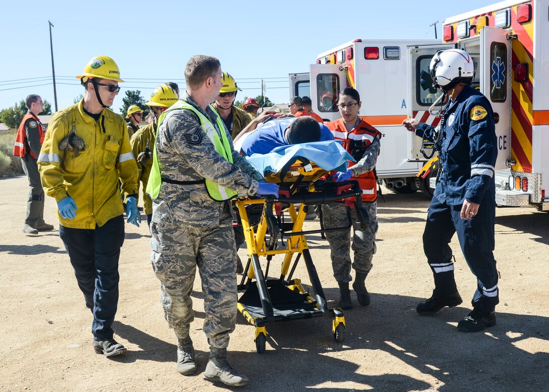 Los Angeles County Fire Department and local emergency response crews prepare to medevac a shooting victim during an active shooter scenario exercise at Desert Junior-Senior High School at Edwards Air Force Base, California, Sept. 18, 2018. (U.S. Air Force photo by Giancarlo Casem)