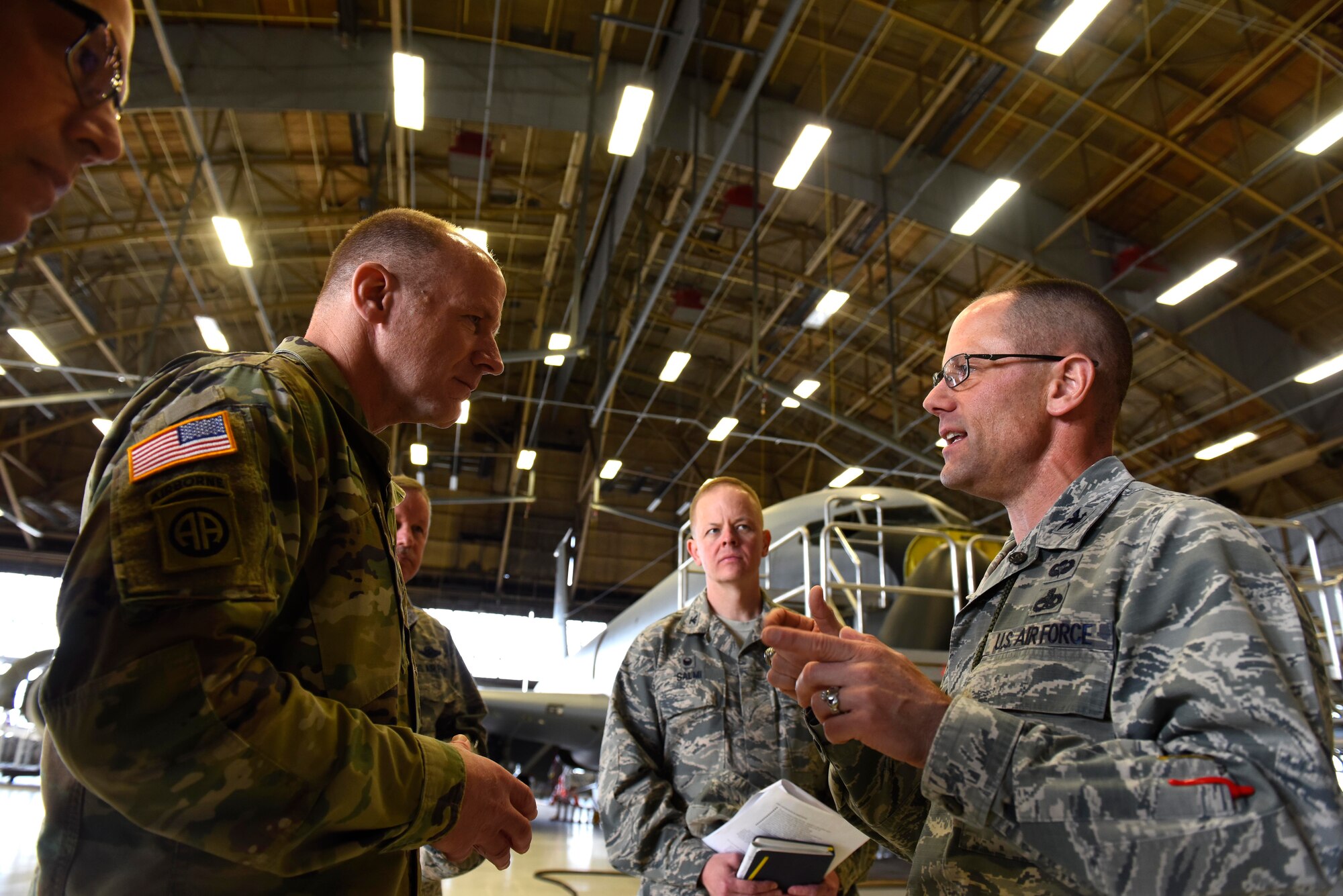 U.S. Army Gen. Stephen Lyons, U.S. Transportation Command commander, and U.S. Air Force Col. Michael O'Connor, 92nd Maintenance Group commander, discuss what it takes to keep the KC-135 Stratotanker mission-ready at Fairchild Air Force Base, Washington, Sept. 19, 2018.