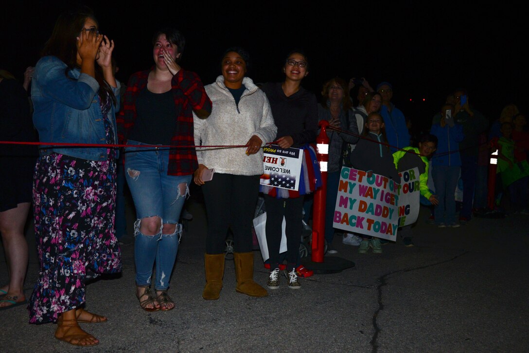 Families from Ellsworth Air Force Base, S.D., await the return of their Airmen from a deployment to Al Udeid Air Base, Qatar, Sept. 18, 2018. During their deployment, aircrews provided critical air presence, precision strike, and surveillance and reconnaissance capabilities to support military objectives in the area. (U.S. Air Force photo by Senior Airman Denise M. Jenson)