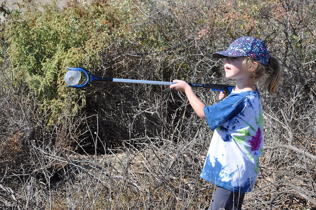 Amelia Jones, 4, picks up a plastic bottle out of the Santa Ana River Marsh during California’s Coastal Cleanup Day Sept. 15 near Newport Beach, California. Amelia is the daughter of Erin Jones, a biologist with the U.S. Army Corps of Engineers Los Angeles District, and Chris Jones, who also is a biologist.