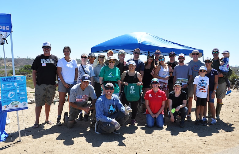 About 25 volunteers pose for a picture after picking up trash Sept. 15 at the Santa Ana River Marsh in Newport Beach, California. The event was part of California Coastal Cleanup Day.