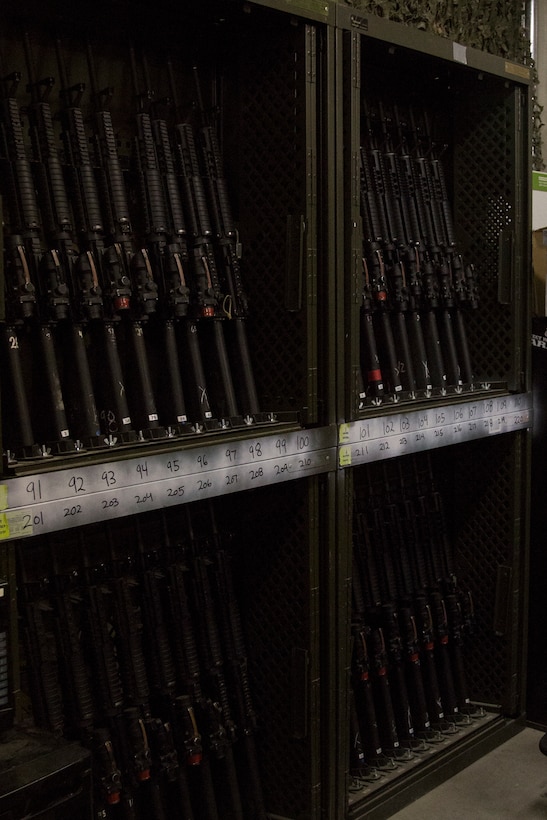 M16 A4 service rifles are stored in numbered slots with in the armory Sept. 19, 2019 at Camp Foster, Okinawa, Japan.