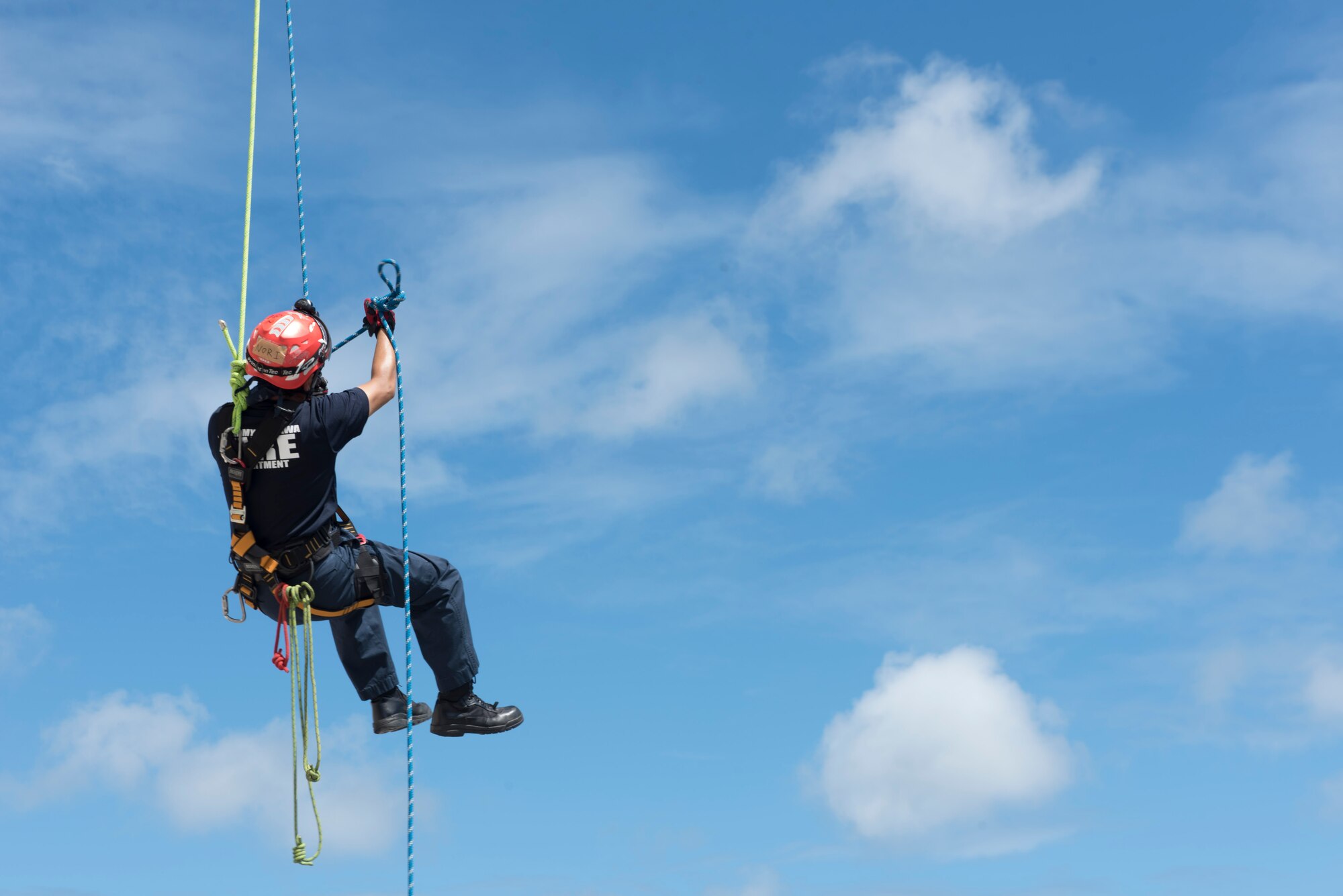 A firefighter from the 18th Civil Engineer Squadron participates in rappelling training Sept. 14, 2018, at Kadena Air Base, Japan. Safety when training is of utmost importance. Each participant was checked, re-checked and cleared by an instructor before rappelling down the building.