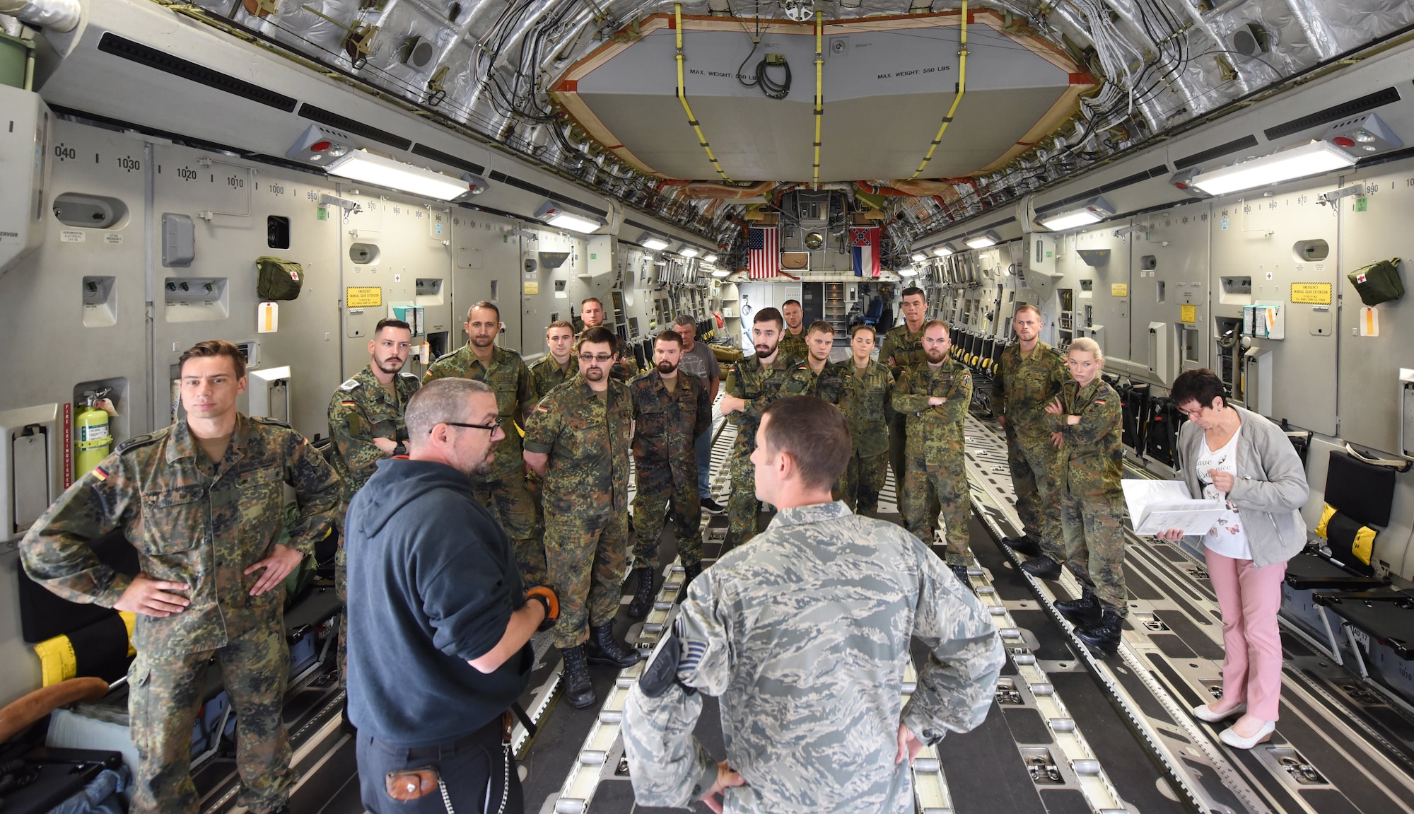 U.S. Air Force Technical Sgt. Alex Rose, 721st Aerial Port Squadron Ramp Service Supervisor, gives German Forces loadmasters a tour inside the static C-17 Globemaster on Ramstein Air Base, Germany, Sep. 13, 2018. These kinds of exercises mutually benefit the United States and Germany by further establishing cooperation and transparency between the two countries.