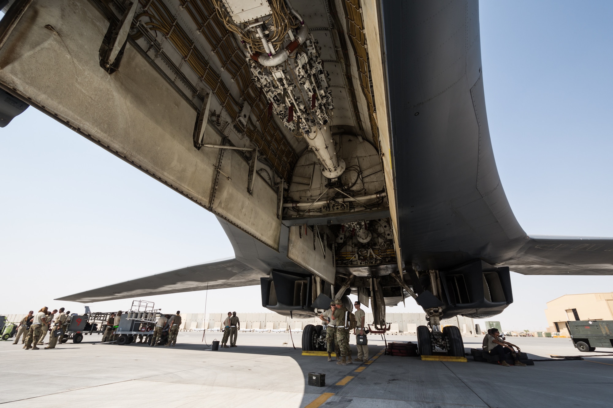 Weapons load crews assigned to the 9th Expeditionary Bomb Squadron conduct a training exercise on the B-1B Lancer with inert munitions at Al Udeid Air Base, Qatar, Sept. 13, 2018. The event involved reconfiguring the aircraft with inert munitions to maintain a high state of readiness. The B-1B Lancer carries the largest conventional payload of both guided and unguided weapons in the Air Force inventory and is the backbone of America's long-range bomber force. It can rapidly deliver massive quantities of precision and non-precision weapons against any adversary, anywhere in the world, at any time. Its armaments include up to 24 AGM-158A Joint Air-to-Surface Standoff Munitions. (U.S. Air Force photo by Tech. Sgt. Ted Nichols/Released)