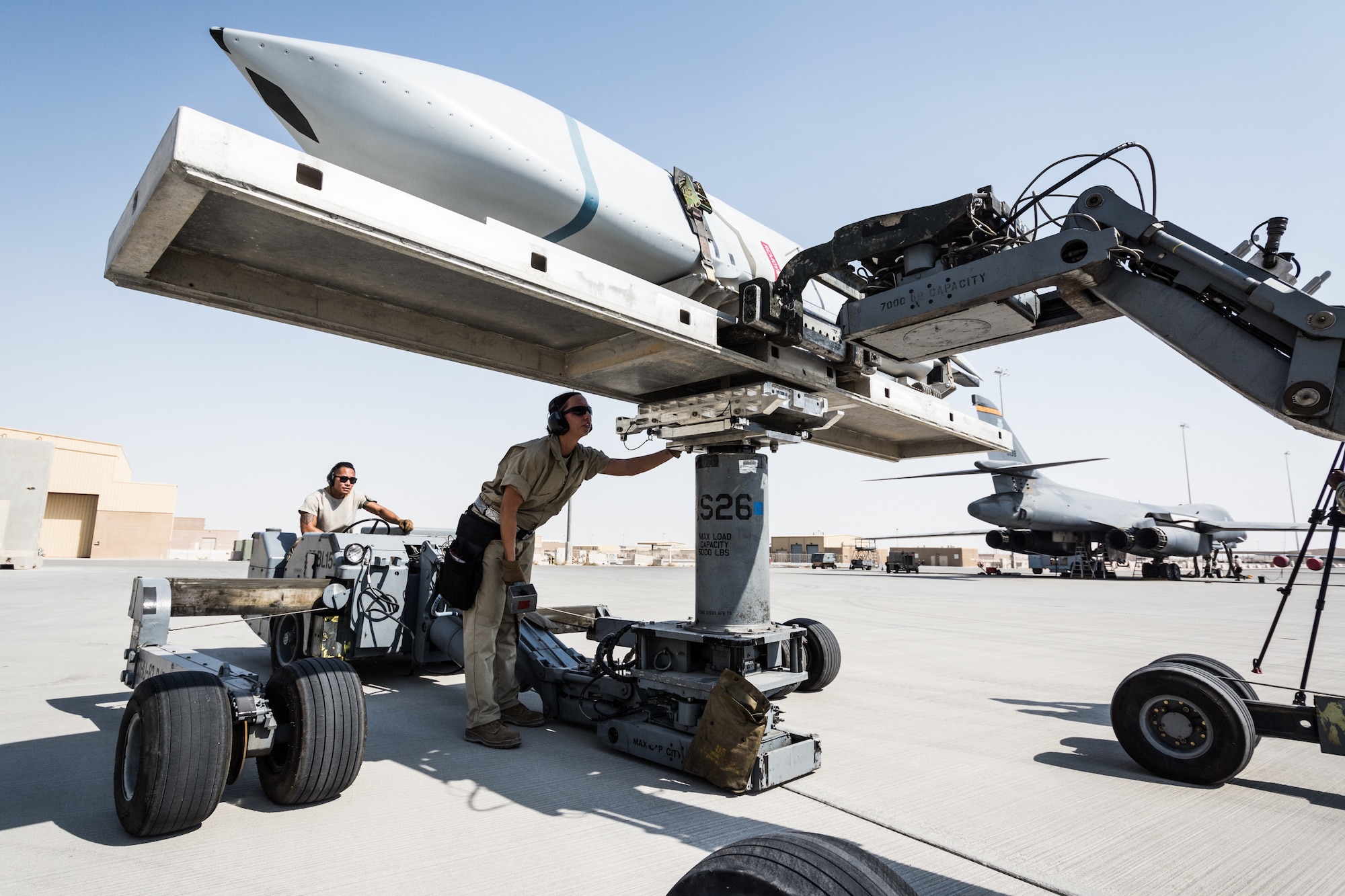 Weapons load crews assigned to the 9th Expeditionary Bomb Squadron conduct a training exercise on the B-1B Lancer with inert munitions at Al Udeid Air Base, Qatar, Sept. 13, 2018. The event involved reconfiguring the aircraft with inert munitions to maintain a high state of readiness. The B-1B Lancer carries the largest conventional payload of both guided and unguided weapons in the Air Force inventory and is the backbone of America's long-range bomber force. It can rapidly deliver massive quantities of precision and non-precision weapons against any adversary, anywhere in the world, at any time. Its armaments include up to 24 AGM-158A Joint Air-to-Surface Standoff Munitions. (U.S. Air Force photo by Tech. Sgt. Ted Nichols/Released)