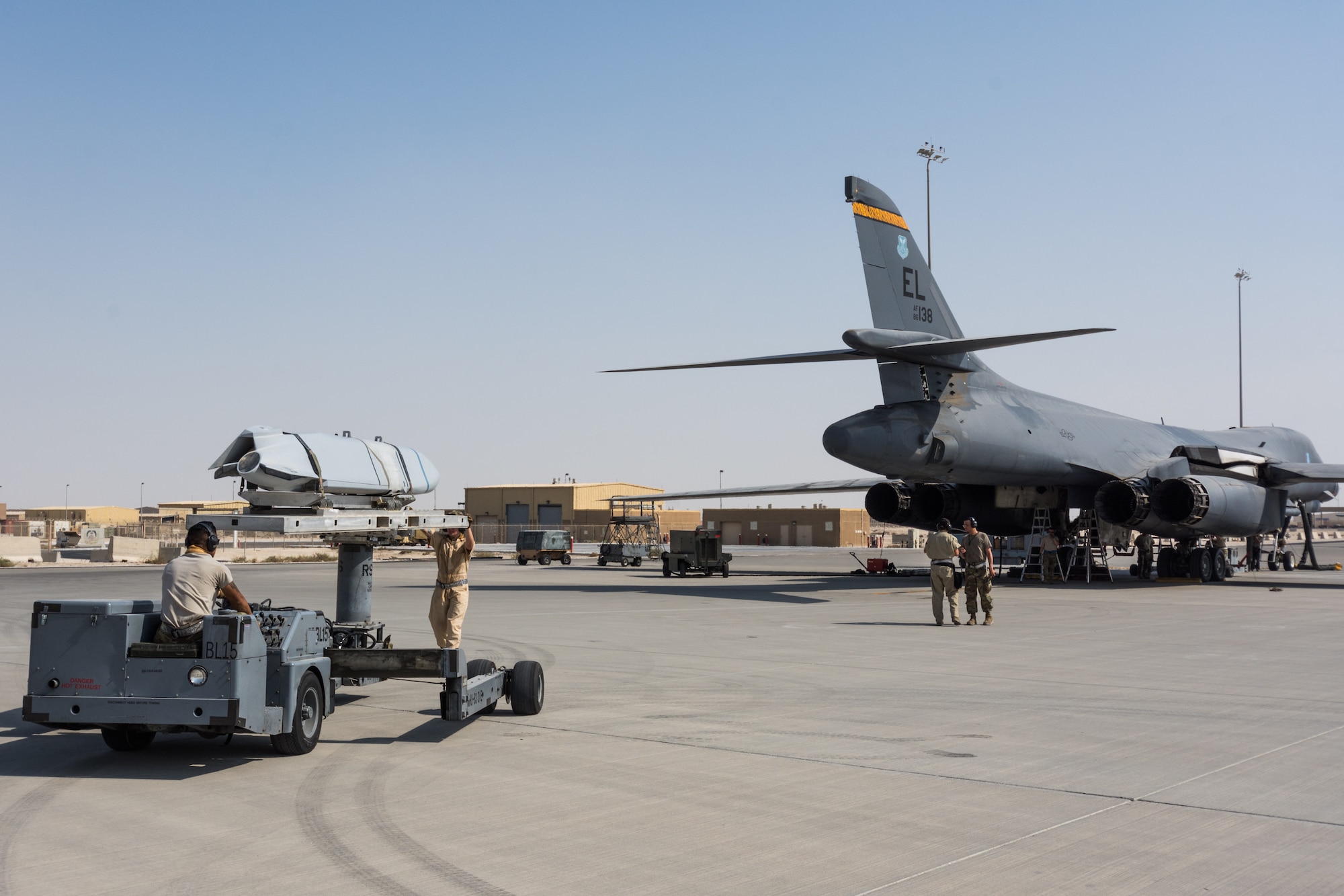 Weapons load crews assigned to the 9th Expeditionary Bomb Squadron conduct a training exercise on the B-1B Lancer with inert munitions at Al Udeid Air Base, Qatar, Sept. 13, 2018. The event involved reconfiguring the aircraft with inert munitions to maintain a high state of readiness. The B-1B Lancer carries the largest conventional payload of both guided and unguided weapons in the Air Force inventory and is the backbone of America's long-range bomber force. It can rapidly deliver massive quantities of precision and non-precision weapons against any adversary, anywhere in the world, at any time. Its armaments include up to 24 AGM-158A Joint Air-to-Surface Standoff Munitions. (U.S. Air Force photo by Tech. Sgt. Ted Nichols/Released)