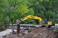 Colorado National Guard Soldiers with the 947th Engineer Company, rebuild Highway 36 west of Lyons, Colo. September 27, 2013. The Colorado National Guard is supporting the Colorado Department of Transportation to make a passable causeway between Lyons and Estes Park that will sustain the communities through to spring when weather will allow civil contractors to fully rebuild the highway to standards. Heavy rains and flash floods destroyed roughly 40% of the highway earlier in the month closing the highway to all vehicle traffic. (U.S. Air National Guard photo by Tech. Sgt. Wolfram M. Stumpf/RELEASED)