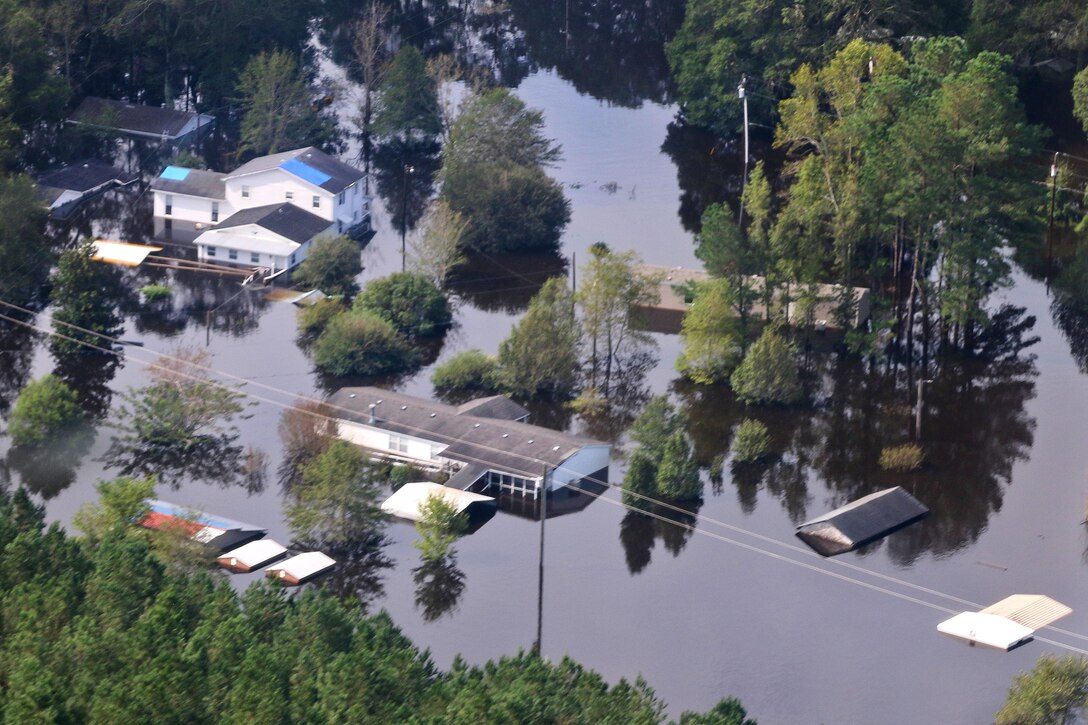 An aerial view shows severe flooding in a small community caused by Tropical Storm Florence near Fort Bragg.