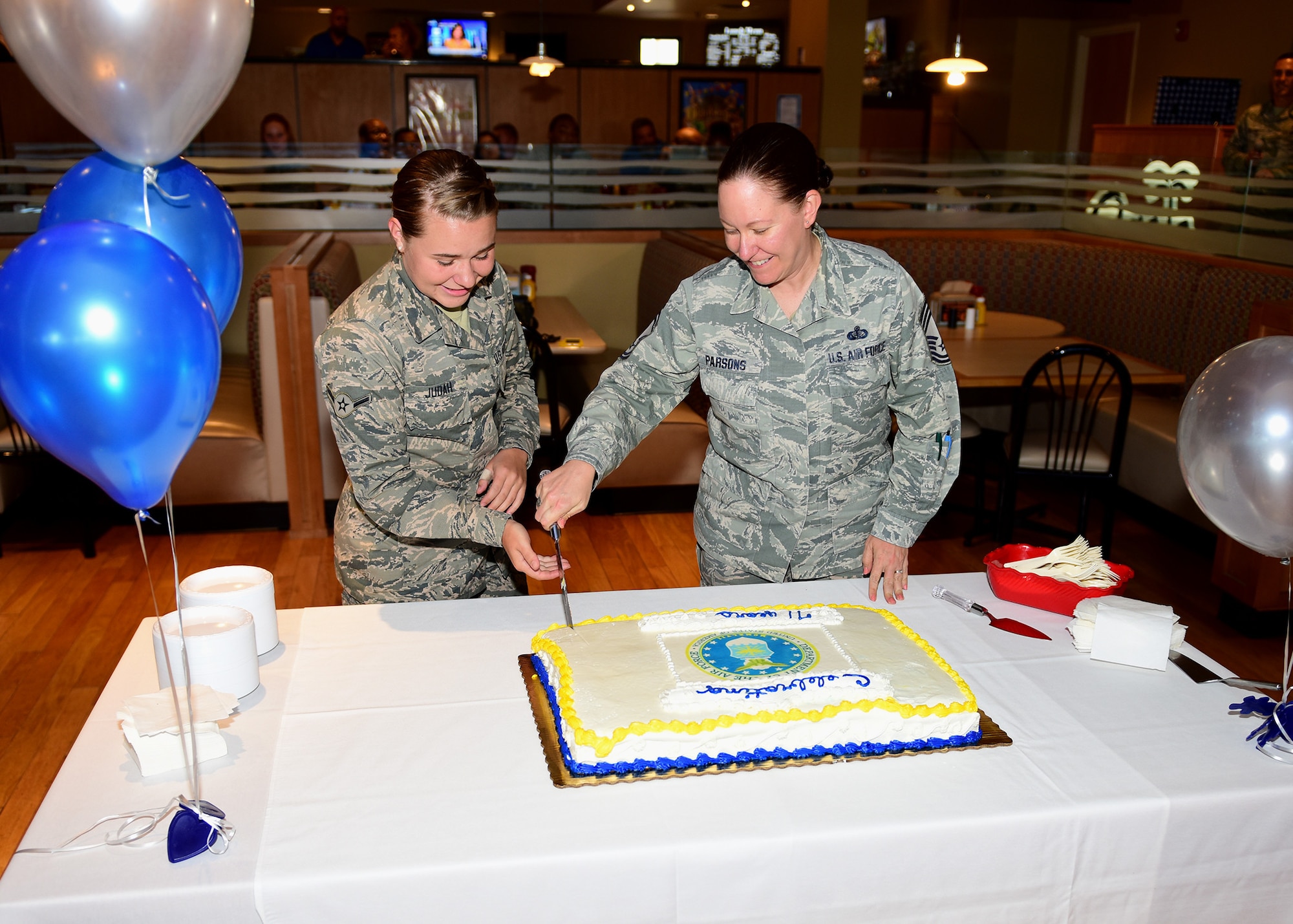 U.S. Air Force Airman Abbey Judah, 325th Force Support Squadron services specialist, and Chief Master Sgt. Tarah Baxley, 325th Medical Group superintendent, cut a ceremonial cake at Tyndall Air Force Base, Fla., Sept. 18, 2018. It is tradition for the youngest and oldest enlisted Airmen at the cake cutting ceremony to cut the cake together in honor of the Air Force birthday. (U.S. Air Force photo by Senior Airman Isaiah J. Soliz)