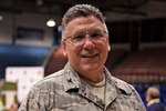 An Air Force officer poses for a photo.