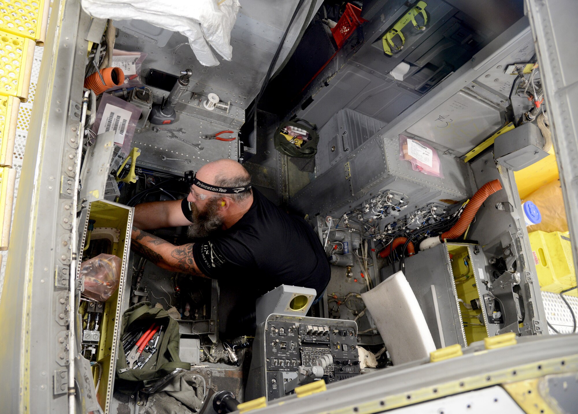 James Goers, aircraft ordnance mechanic, works on a B-1 ejection system.