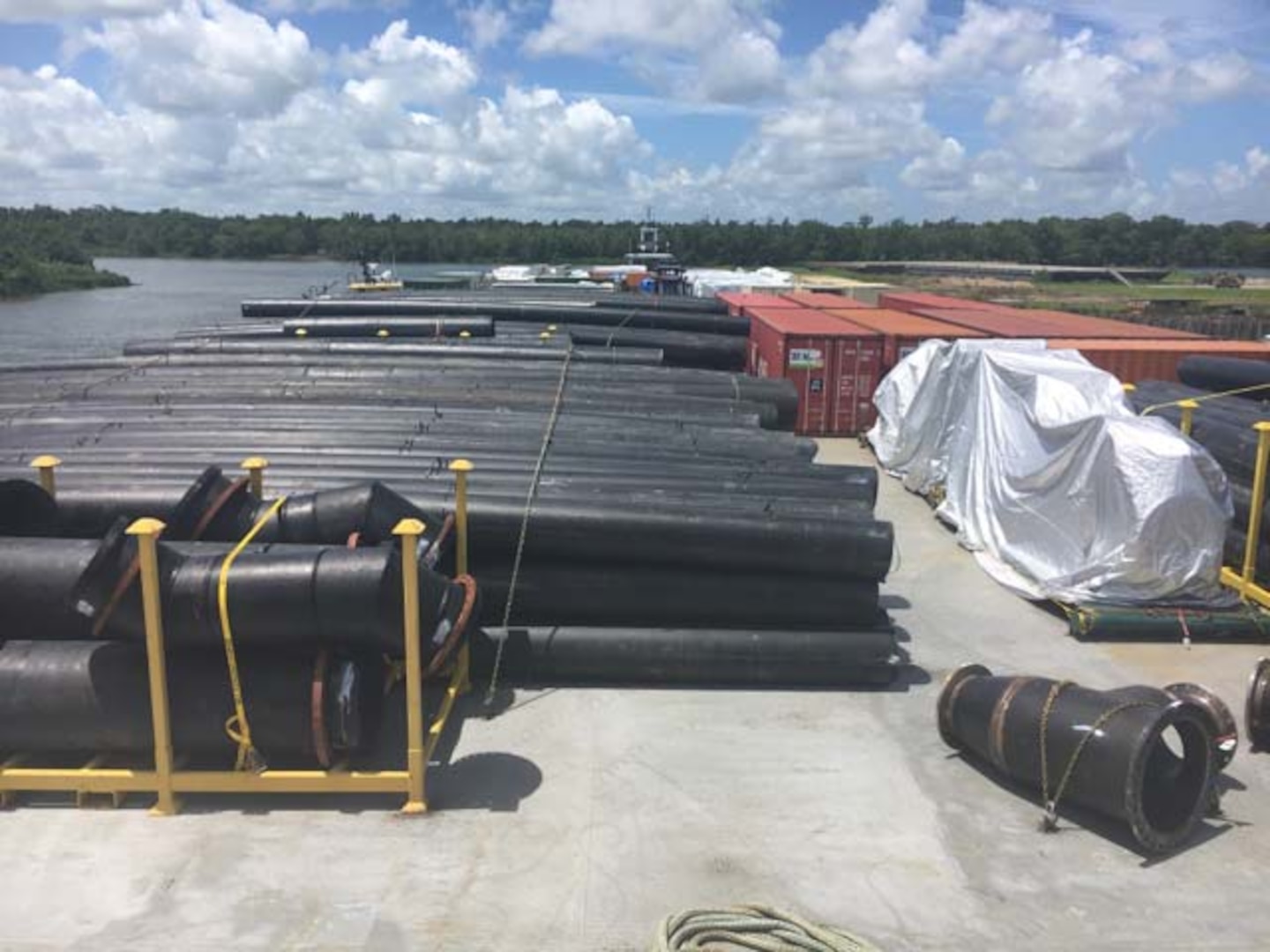Donjon's barge loaded with piping, CONEX boxes, pumps and spare parts prior to sailing from Morgan City, LA