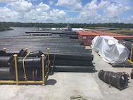 Donjon's barge loaded with piping, CONEX boxes, pumps and spare parts prior to sailing from Morgan City, LA