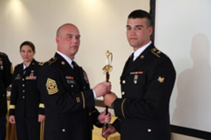 ​Colorado Army National Guard Commander Brig. Gen. Dana Capozzella (far left) looks on while State Command Sgt. Maj. Ken Berube stands with Spc. Nathaniel Hill, Nevada Army National Guard, winner of the Soldier category in the Best Warrior Region VII competition at Fort Carson, Colo., April 7, 2013. Hill won the Soldier category of the competition, which consisted of 16 elite noncommissioned officers and Soldiers from Guam, Hawaii, California, New Mexico, Colorado, Utah, Arizona and Nevada. The competition tested participants' endurance, mental toughness and resolve. (Official Army National Guard photo by Sgt. Richard McMullen/RELEASED)