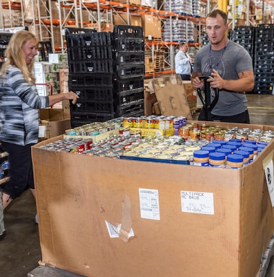 Volunteers unload donations for Feds Feed Families