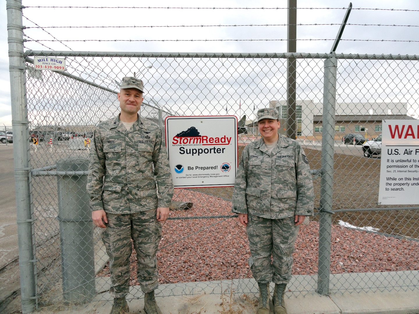 Air National Guard Col. Greg White, commander of the 233rd Space Group, and Tech. Sgt. Michelle Leonard, 233rd Space Group Emergency Manager, display the group's StormReady status at Greeley Air National Guard Station in Greeley, Colo., Jan. 23, 2013. (File photo)