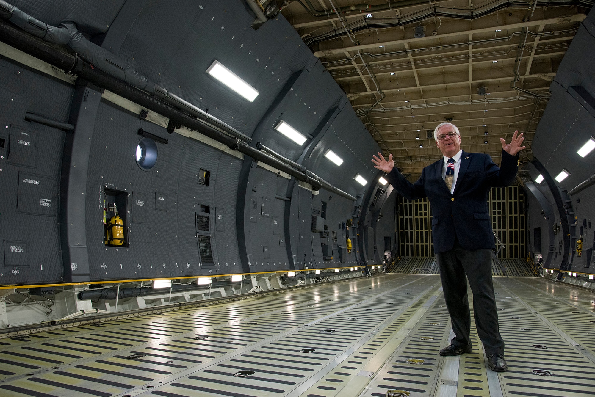 Rich Butler, Air Mobility Command C-5 requirement manager, walks through a C-5M Super Galaxy, Aug. 2, 2018. Butler was on the final flight where the Air Force and Lockheed Martin completed its last C-5M Super Galaxy upgrade on Aug. 6, 2018, a flight that was 18 years in the waiting. (U.S. Air Force photo by Staff Sgt. Julio A. Olivencia Jr.)