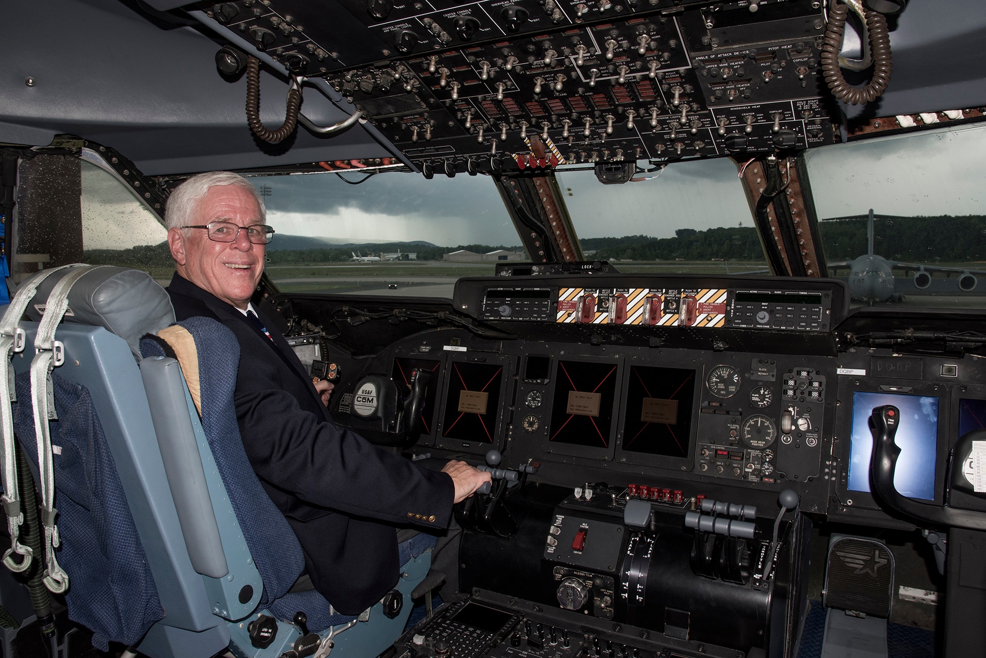 Rich Butler, Air Mobility Command C-5 requirement manager, walks through a C-5M Super Galaxy, Aug. 2, 2018. Butler was on the final flight where the Air Force and Lockheed Martin completed its last C-5M Super Galaxy upgrade on Aug. 6, 2018, a flight that was 18 years in the waiting. (U.S. Air Force photo by Staff Sgt. Julio A. Olivencia Jr.)