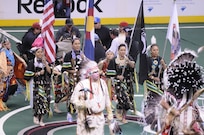 Members of the Sister Nations Color Guard, Colorado Army National Guard Staff Sgt. Cindy Littlefeather, Glenda Littlebird, Sgt. 1st Class Toni Eaglefeathers, and Carissa Gonzales, display the colors as part of a Native American presentation during halftime at a Colorado Mammoth versus Rochester Knight Hawks lacrosse game, March 2, 2012, at the Pepsi Center in Denver. The Sister Nations is a group of current and former Native American Soldiers who perform traditional dance and color guard. (Army National Guard photo by Capt. Michael Odgers/Released)
