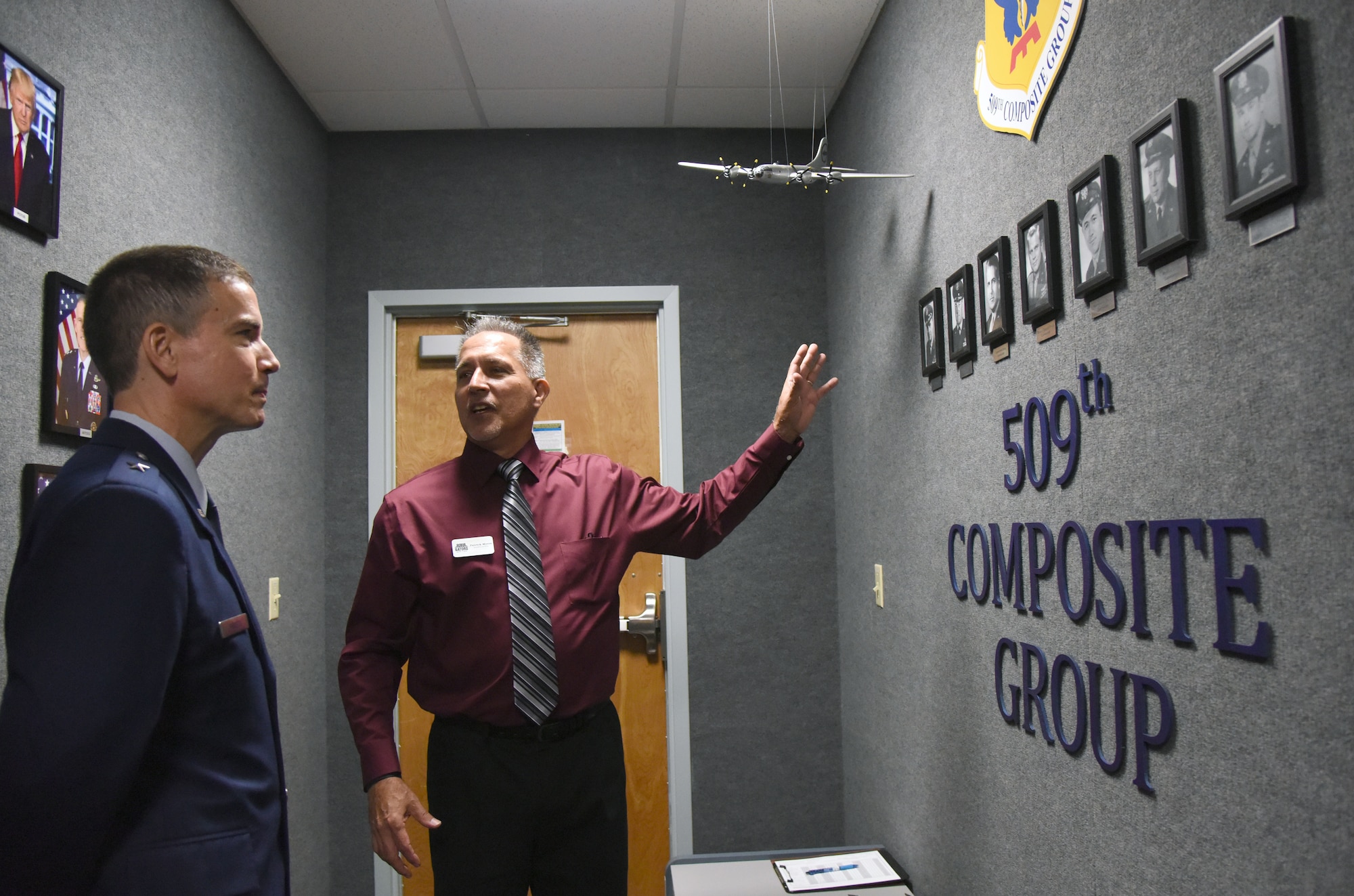 Patrick Myers, 334th Training Squadron command and control operations apprentice course master instructor, provides a tour to U.S. Air Force Brig. Gen. Paul W. Tibbets IV, Air Force Global Strike Command deputy commander, Barksdale Air Force Base, Louisiana, during a room dedication ceremony at Cody Hall on Keesler Air Force Base, Mississippi, Sept. 14, 2018. The dedication honored Tibbets' grandfather, retired Brig. Gen. Paul W. Tibbets Jr., by dedicating the 334th Training Squadron Command and Control simulator in his name. Tibbets Jr., piloted the Enola Gay, which dropped the world's first atomic bomb. (U.S. Air Force photo by Kemberly Groue)