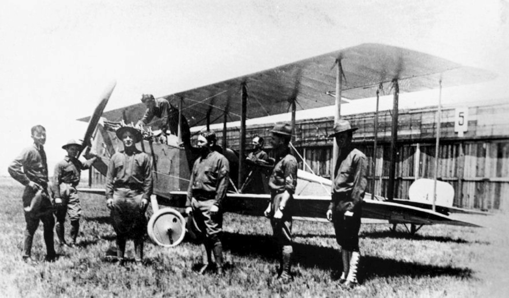 The first Curtiss JND2s of 1st Aero Squadron at the Signal Corps Aviation School, North Island, Cali., Sgt. Vernon L. Burge stands under the propeller. In the cockpit is Capt. Benjamin Foulois and second man from the right is Jacob Bollinger. (Vernon L. Burge Collection/Airman Memorial Museum Courtesy Photo)